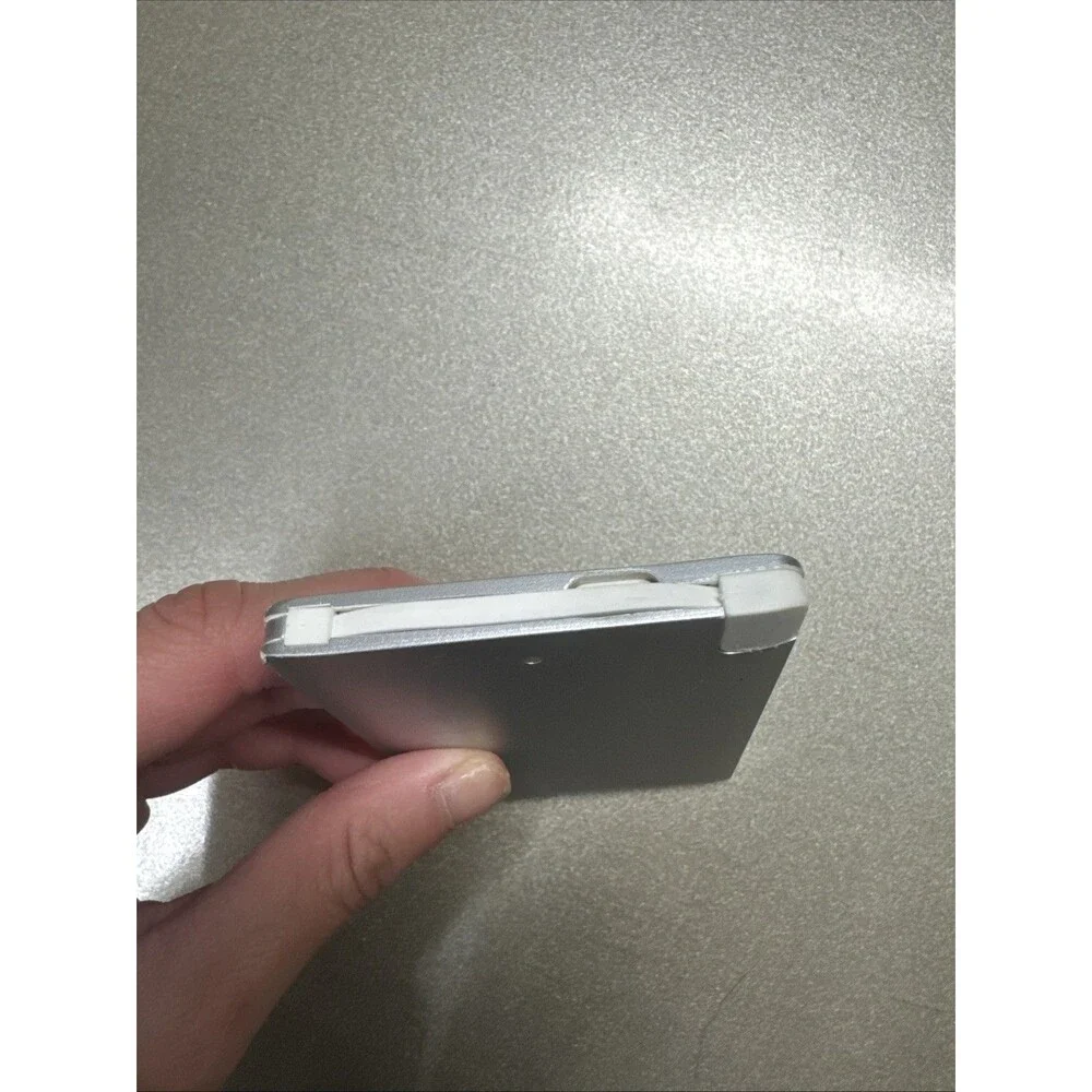 Ultra Slim portable charger silver with looks like Micro-USB cord see photos